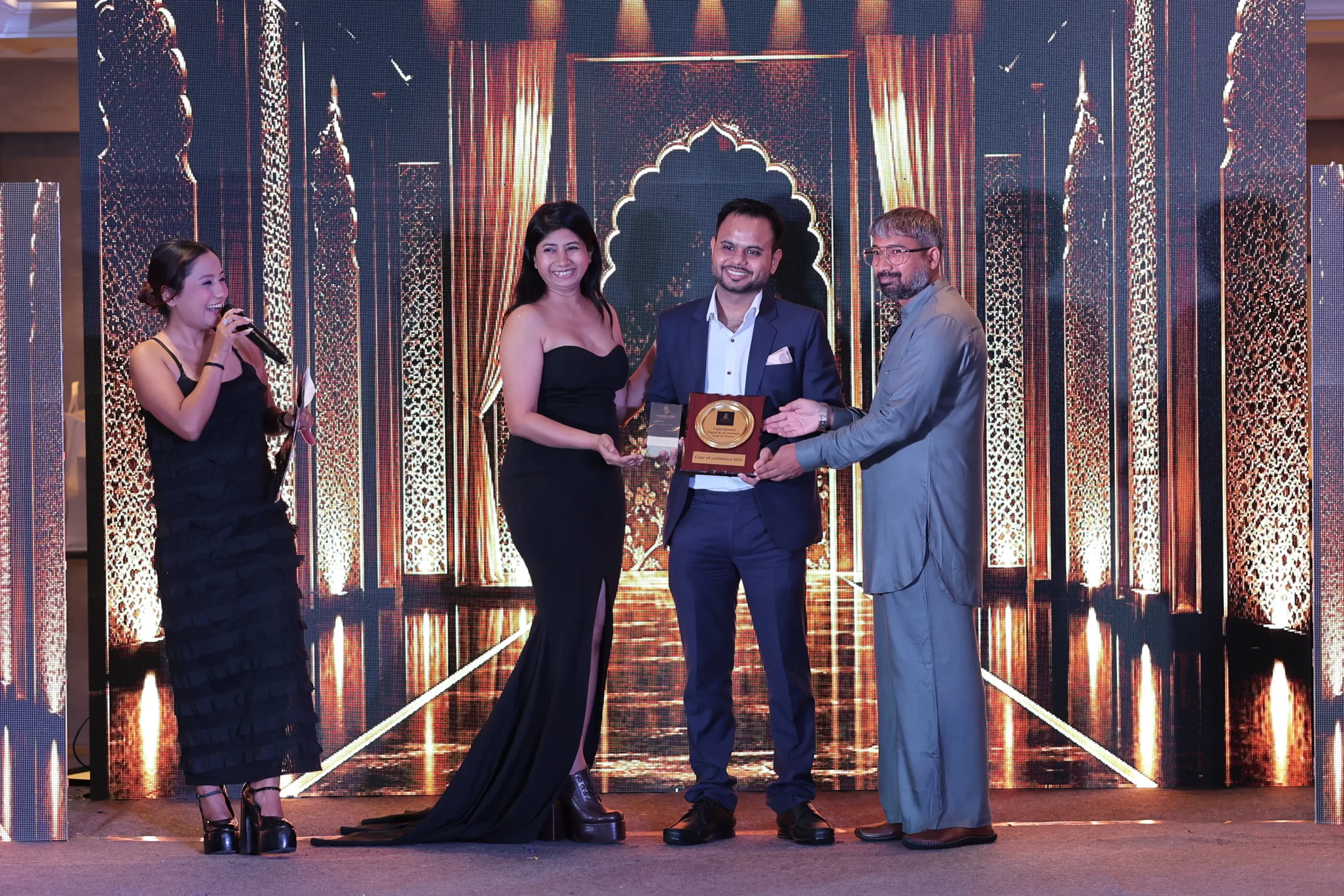 Vipin Khuttel being honoured on stage as Guest of Honour at Cape of Confidence 2026, Gurugram